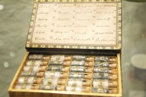 Image: Box of old vials containing medicinal and poisonous substances.